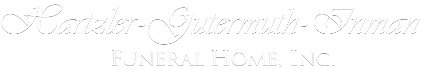 Saralee Gutman Toman Funeral Home, Inc. logo in pale gray script on a white background
