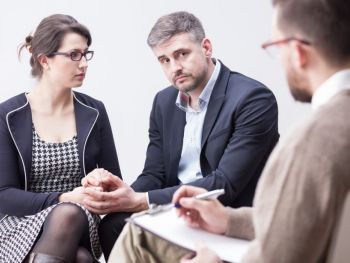 couple having a interview with an attoreny