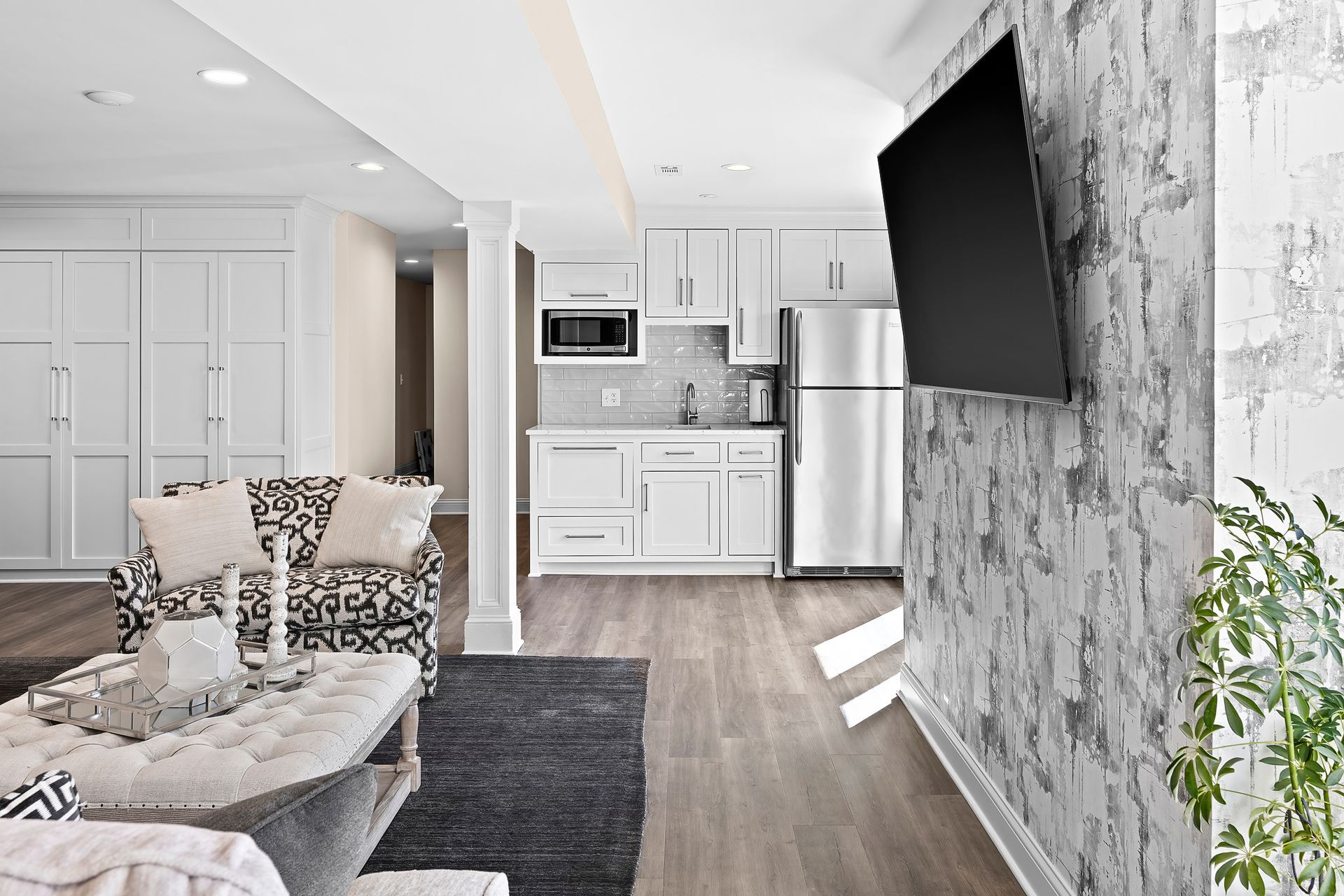 Remodeled living room with TV by Gartman Remodeling in Kansas City