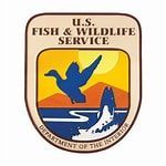 U.S. Fish & Wildlife Service logo with a blue wildlife silhouette, fish, and bird over a sunset shield
