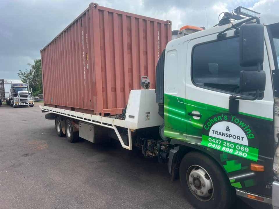 A Tow Truck With a Red Container on the Back  — Cohen’s Towing & 4WD Recoveries In Alice Springs, NT