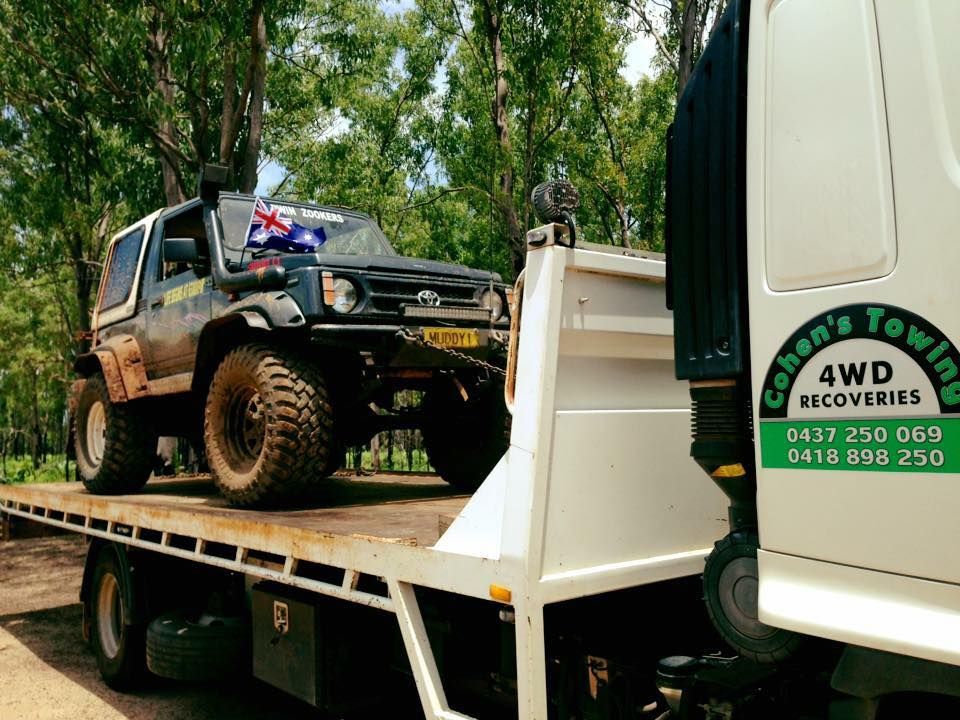 A Jeep is Sitting on Top of a Tow Truck — Cohen’s Towing & 4WD Recoveries In Winnellie, NT