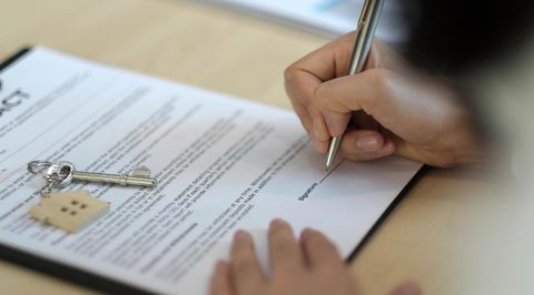 worker writing in the paper