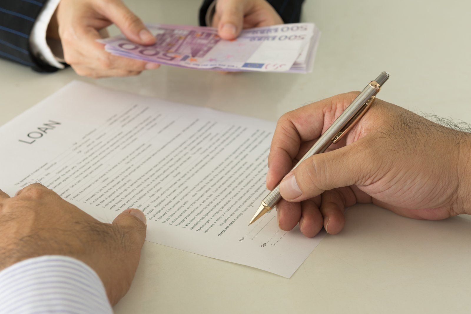 worker holding a pen