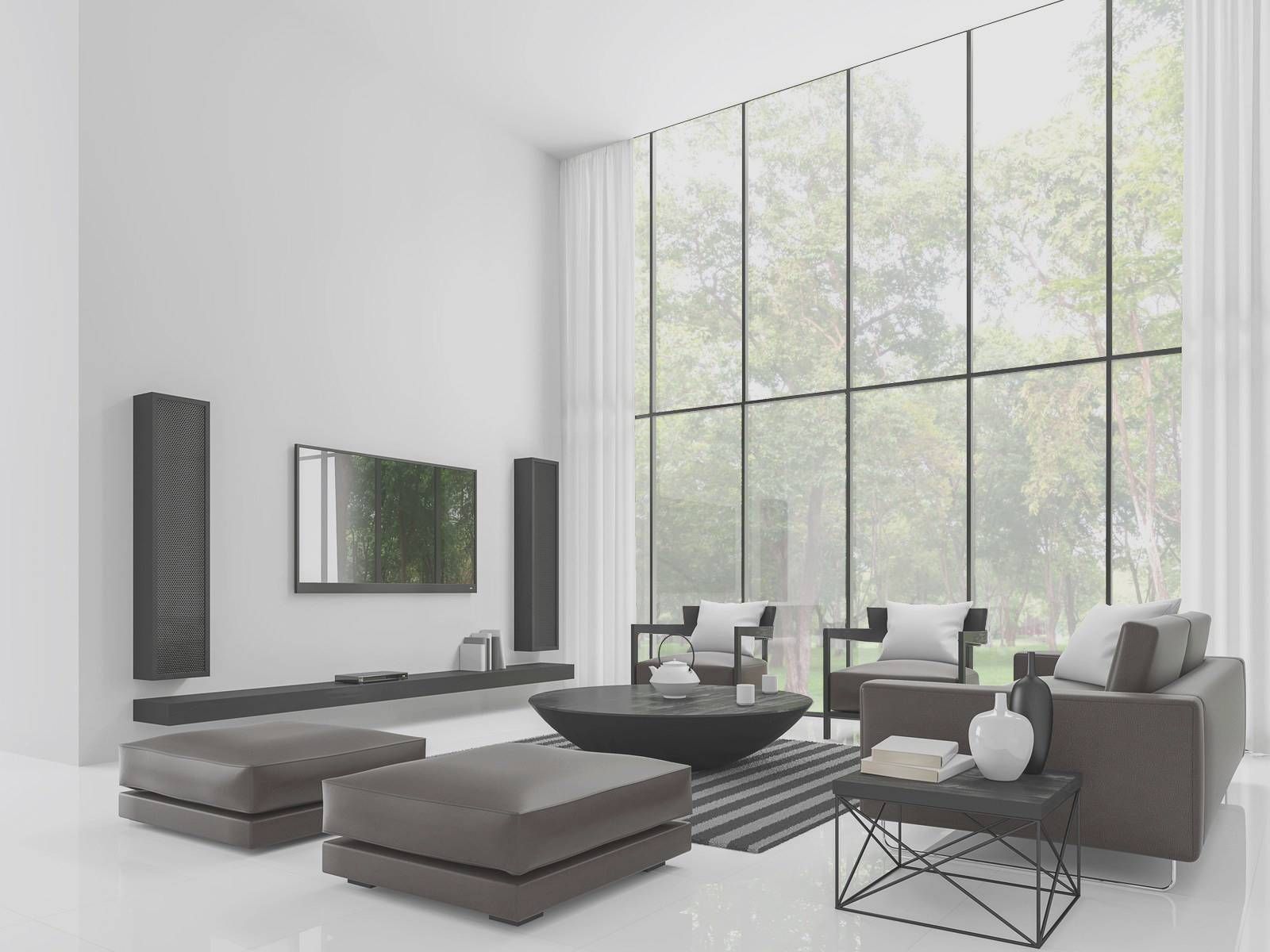A living room with a lot of windows and furniture.