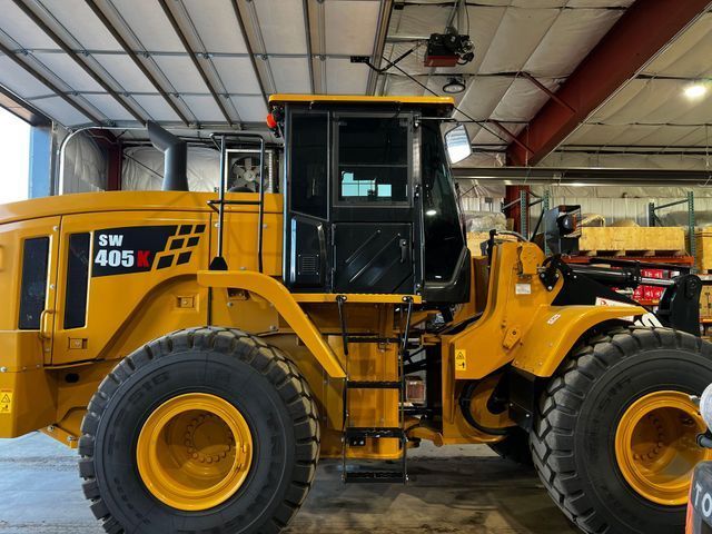 A yellow tractor with the number 405 on it