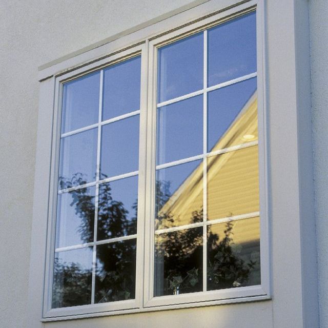 A white window with a blue sky behind it
