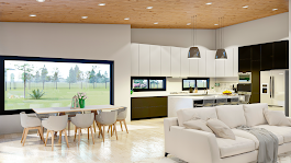 Una sala de estar con sofá, mesa y sillas y una cocina.