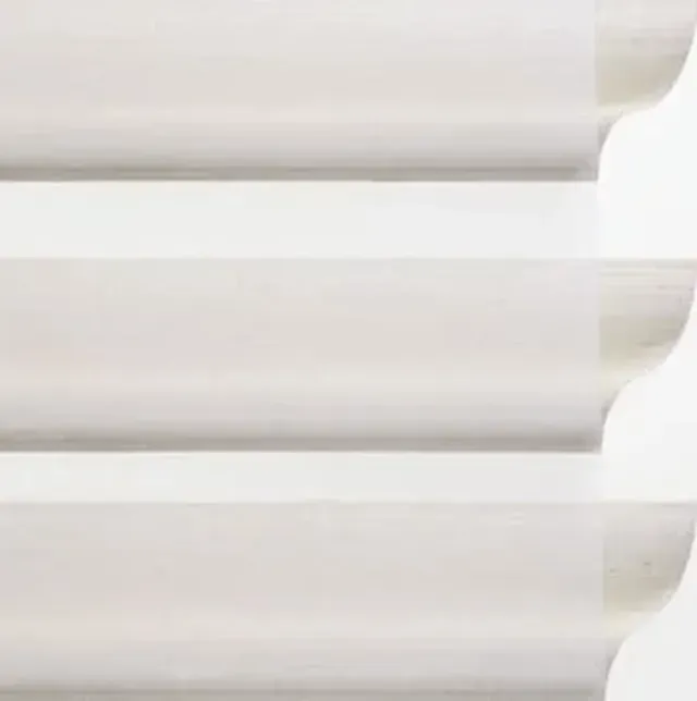 Close-up of three white, horizontal pleats, possibly from a blind or window covering.