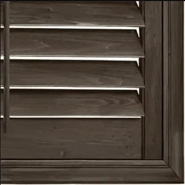 Dark brown wooden window shutters, partially open, with visible slats and frame.