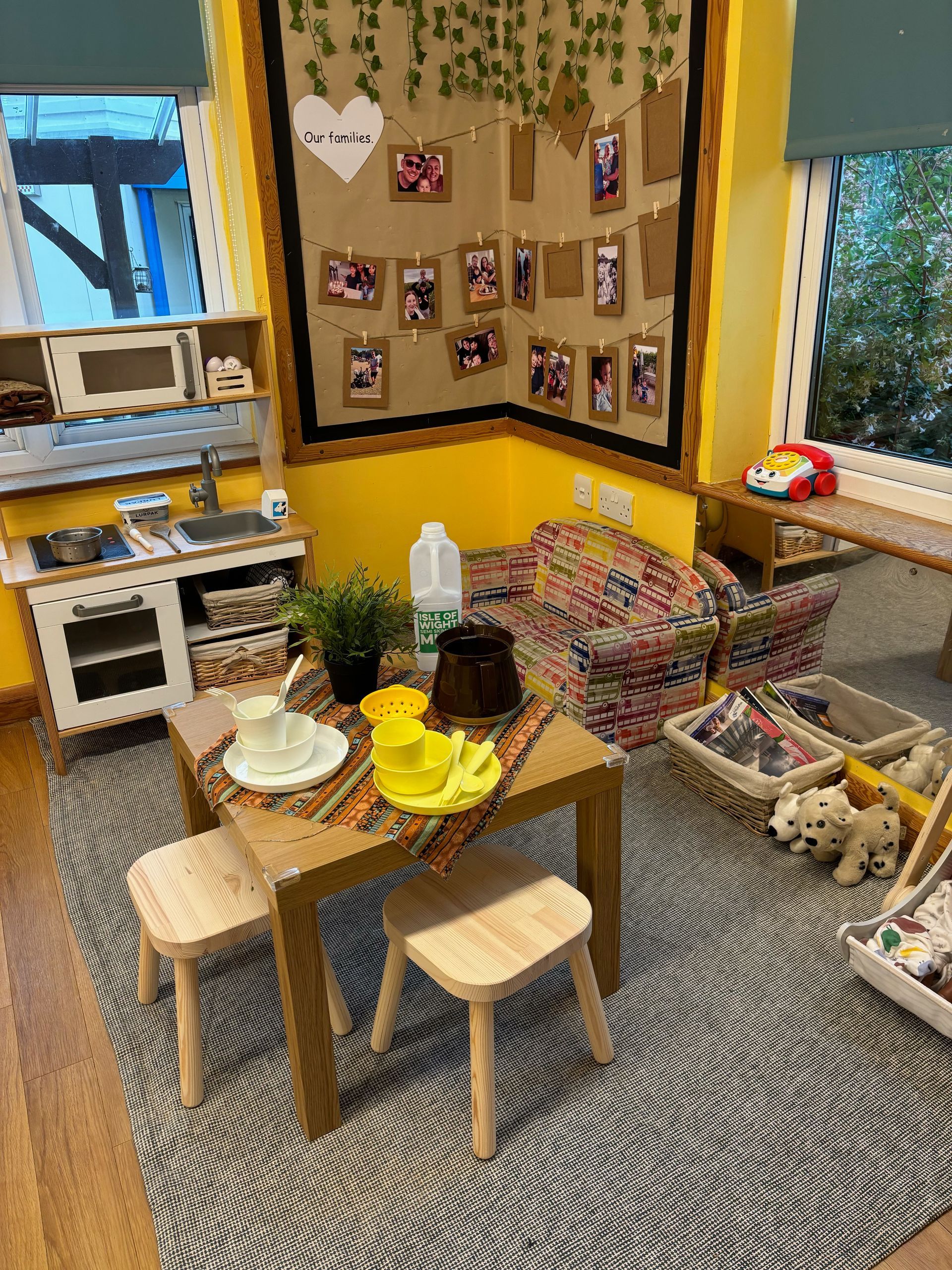 A room with a table and chairs in it and a kitchen.