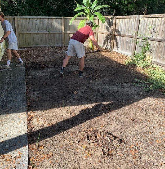 Two Men Leveling the Soil — Mount Pleasant, SC — Tidewater Landscape LLC