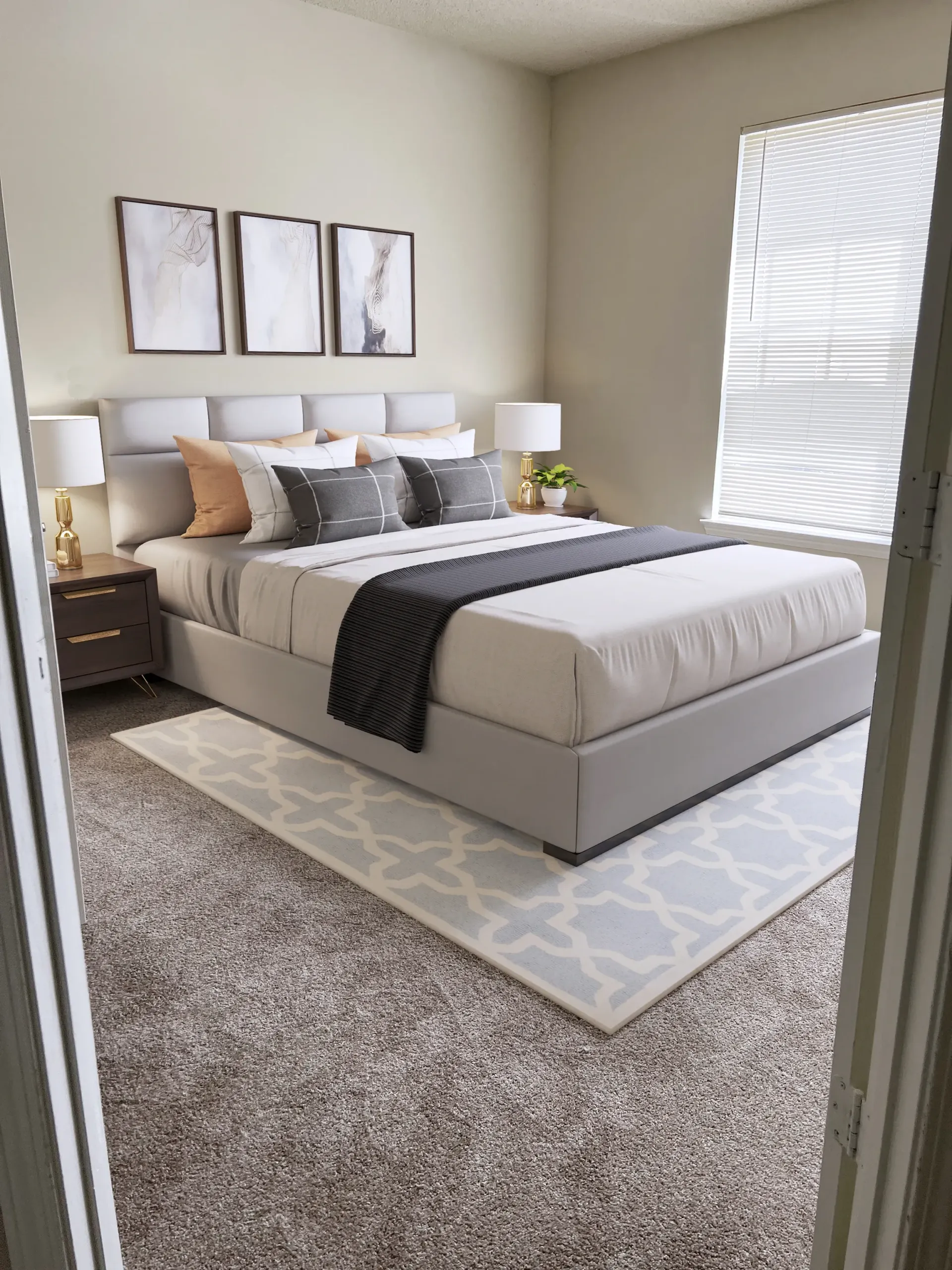 Cozy bedroom with a large bed, nightstands, and decor.