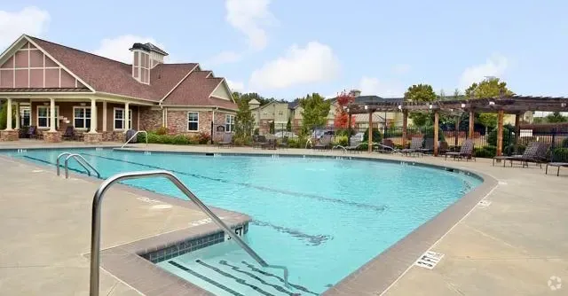 Swimming pool and clubhouse exterior.