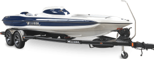 A white and blue motorboat on a black trailer, ready for transport.