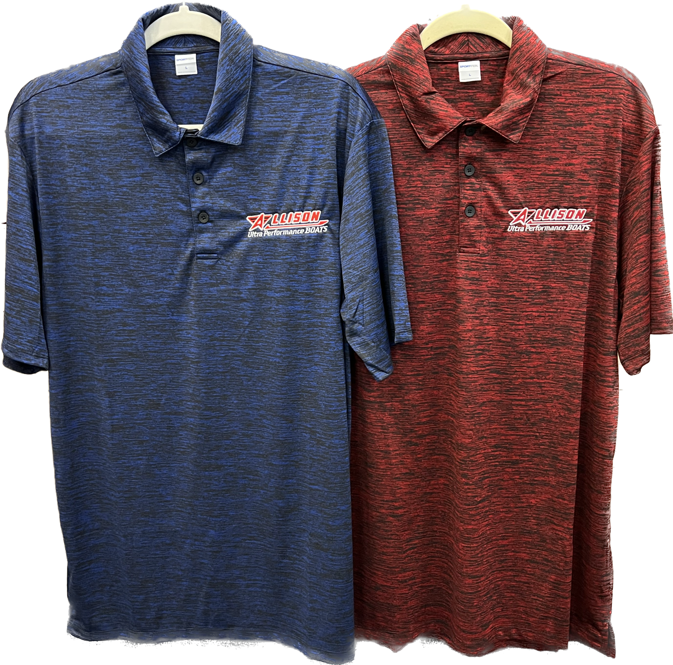 Two polo shirts, blue and red, with logo, hanging on white hangers.