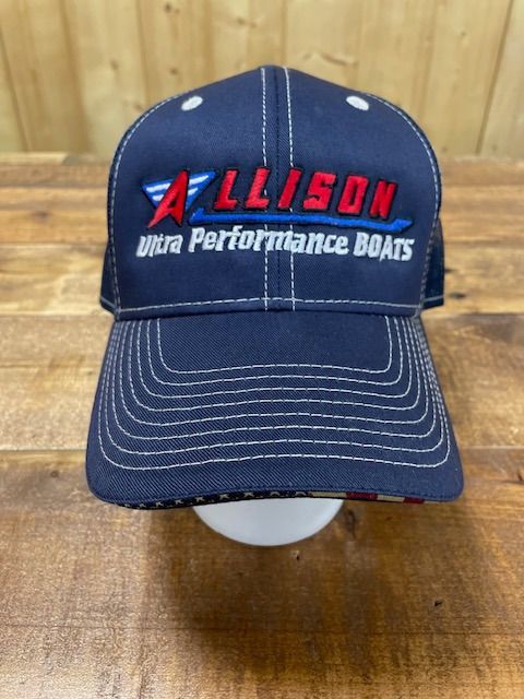 Navy blue Allison Ultra Performance Boats hat with white stitching and logo, on a wooden surface.