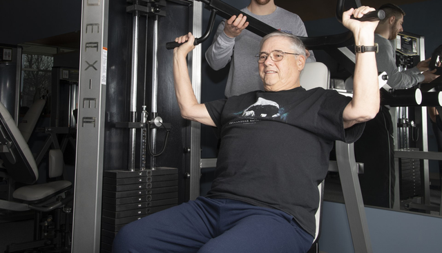 An Older Man is using a Machine in a Gym that says Flex-fit | Uniontown, OH | My Personal Trainer