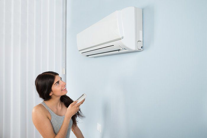 Lady And Her Air Conditioer