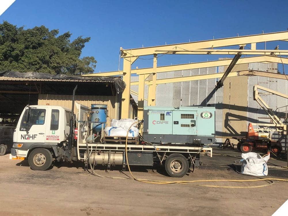 A Truck With a Generator on the Back is Parked in a Building — North Queensland Hard Facing (NQHF) In Fredericksfield, QLD