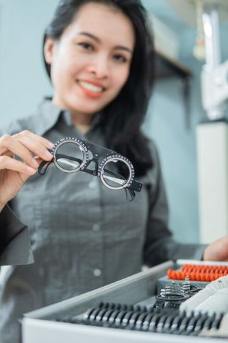 Optometrist conducting eye exam