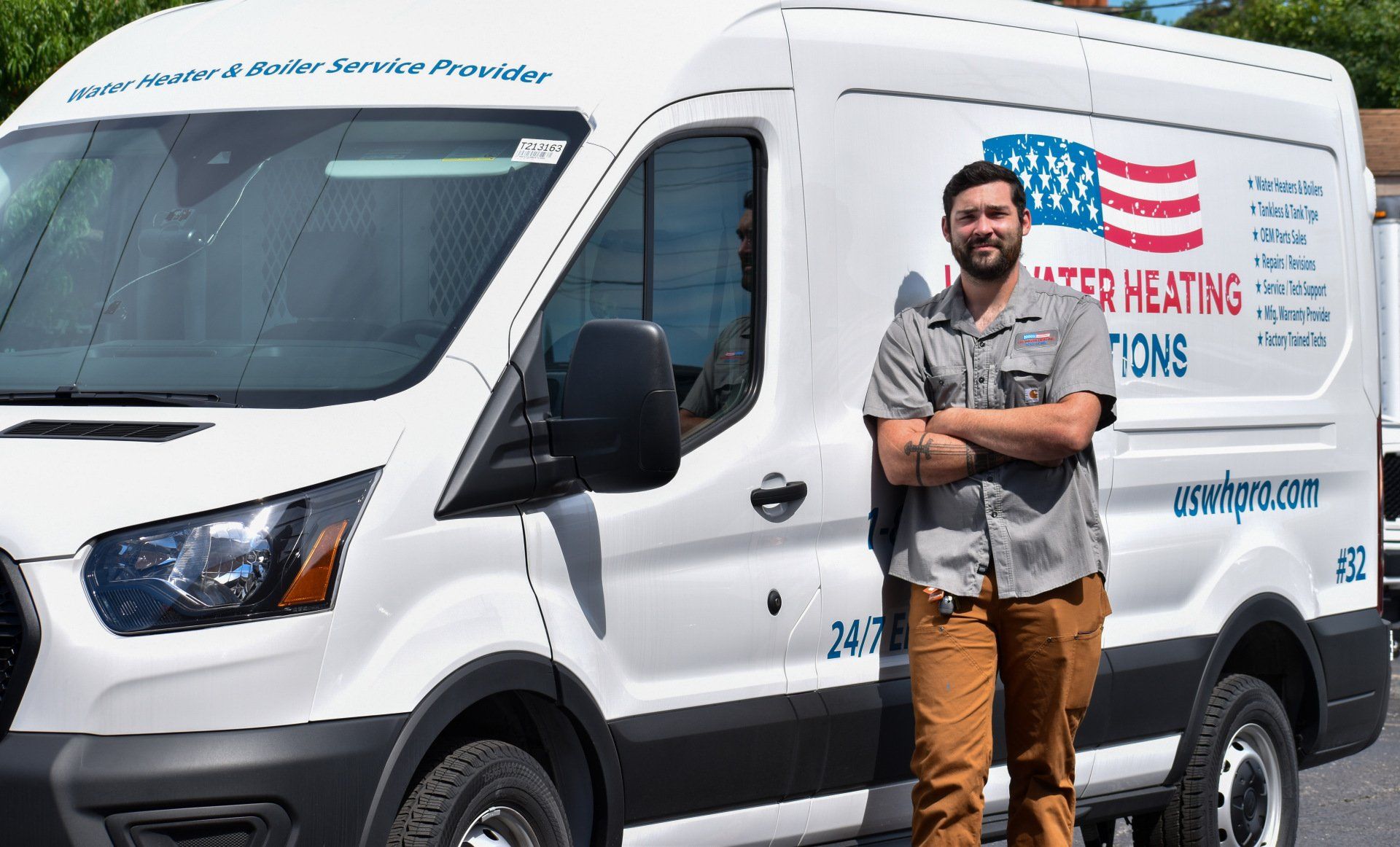 tech in front of service truck