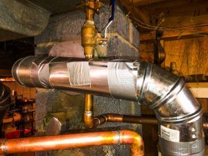 Improper water heater venting held together with duct tape