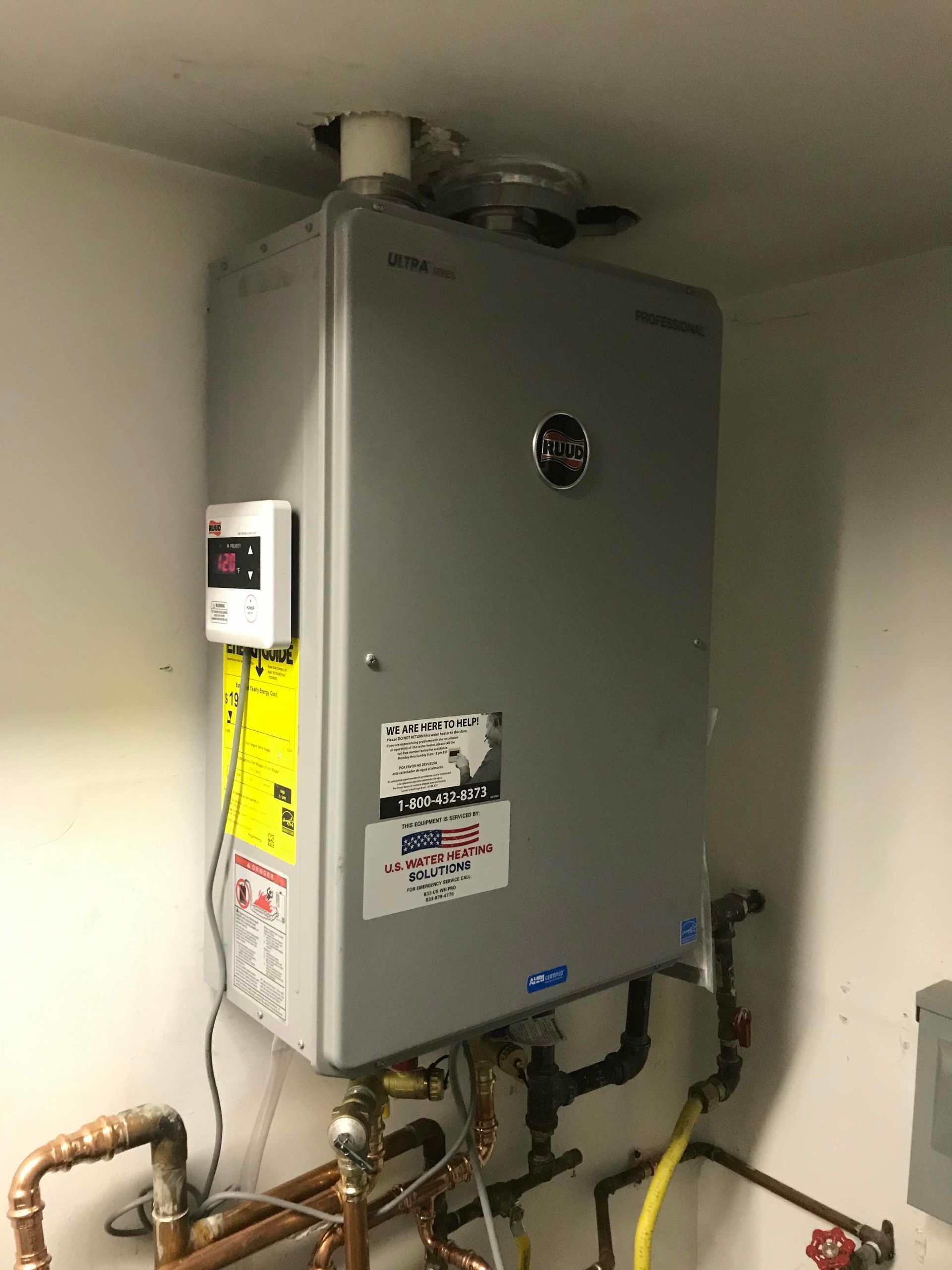 After the removal of a Takagi TKD20 tankless water heater and installation of a Ruud RUTGH-86DVLN-2 tankless water heater in Milwaukee, Wisconsin