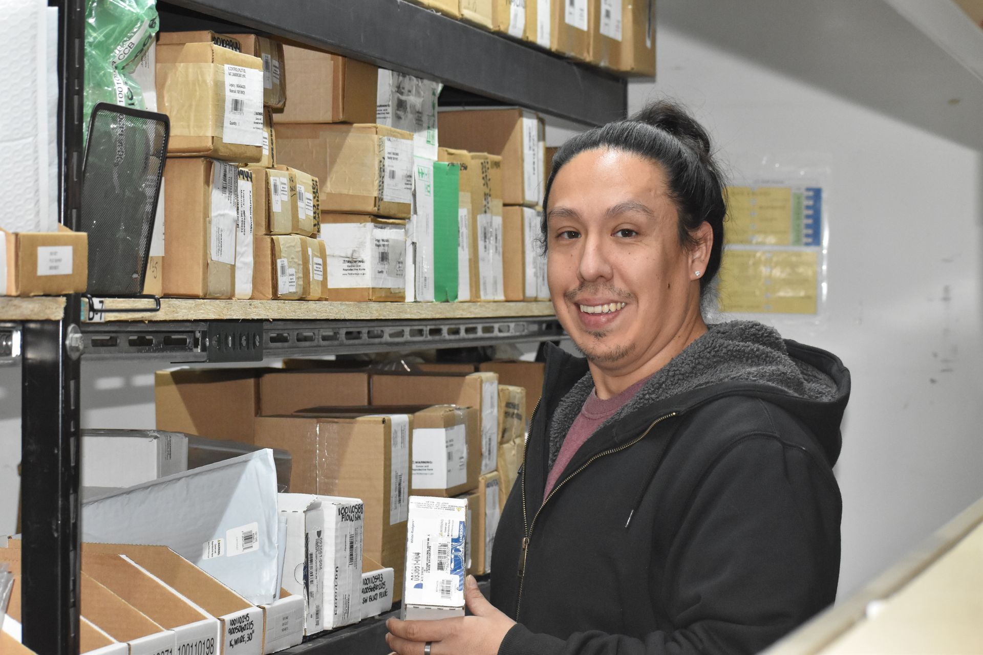 Warehouse team member gathering commercial parts for client