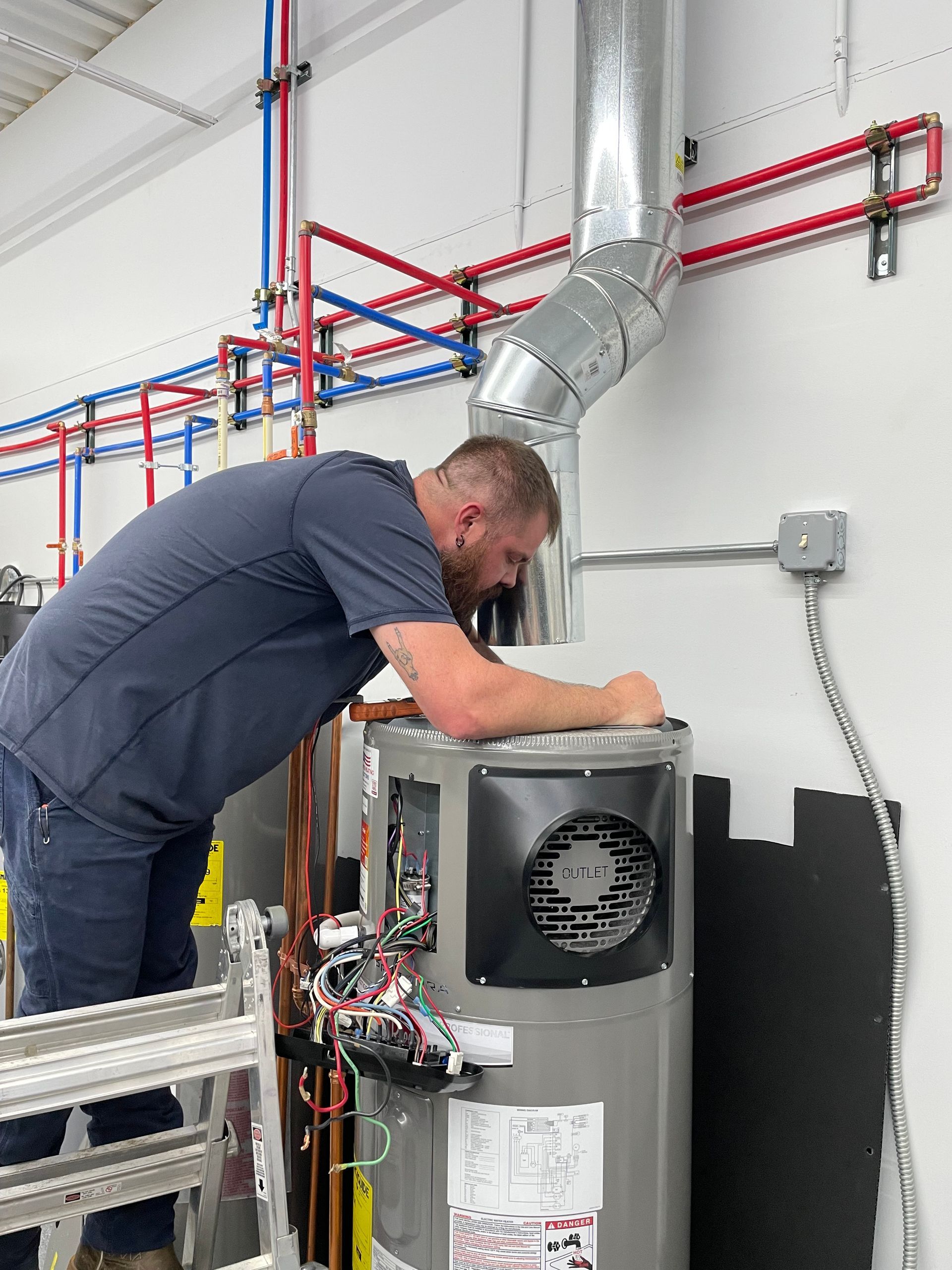 Water Heater Repair Technician Working on Heat Pump Water Heater