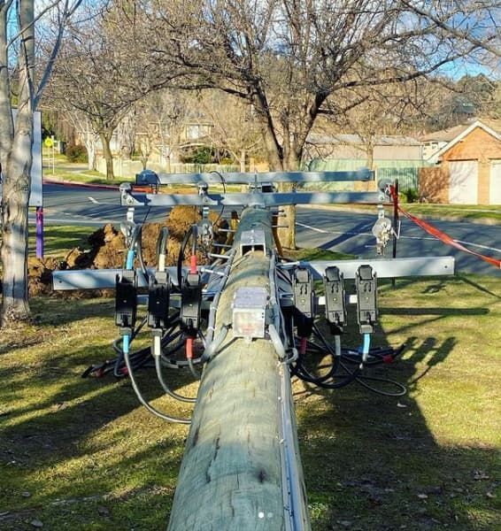 Utility Pole With Wires and Transformers in a Residential Area — Central West Power Construction in Orange, NSW
