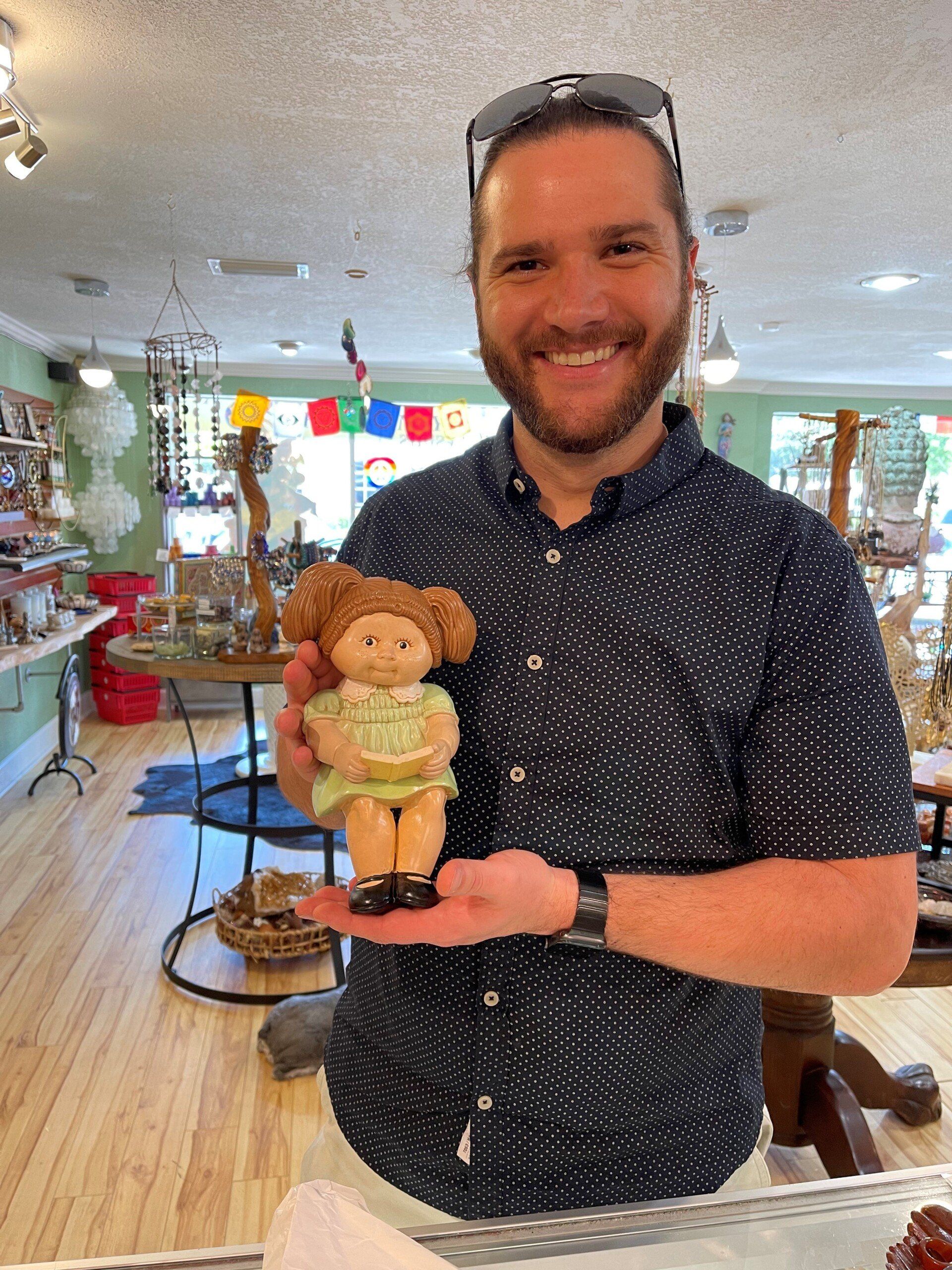 Man Holding A Doll — Tampa, FL — Antique Restoration and Design