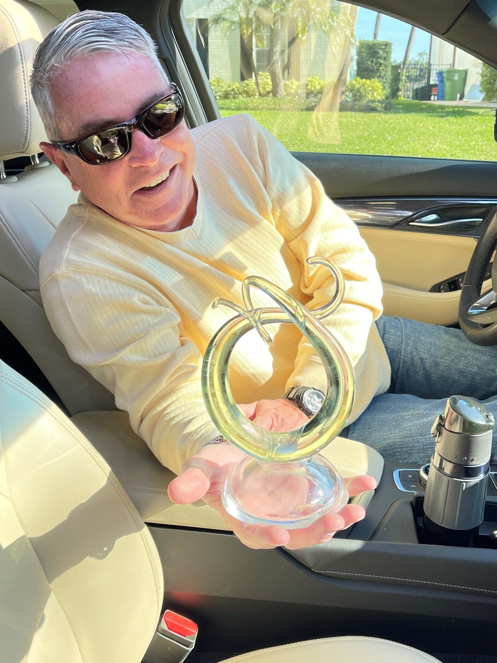 Woman Holding Murano Crystal — Tampa, FL — Antique Restoration and Design