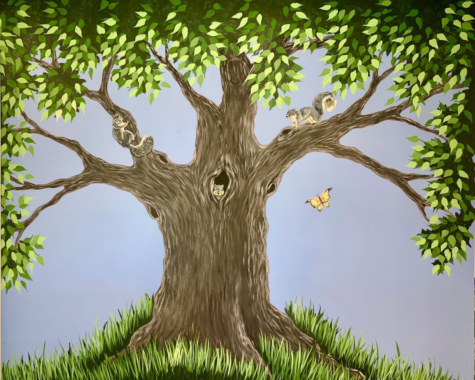 Painting of a leafy tree in a pediatricians office