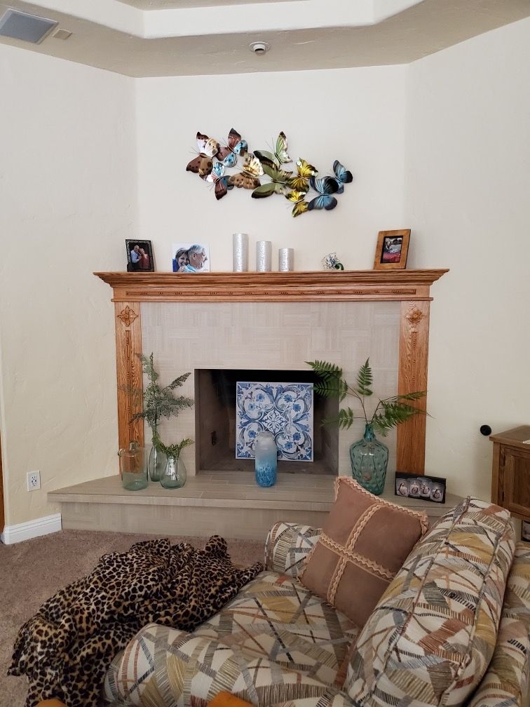 A living room with a fireplace and a couch