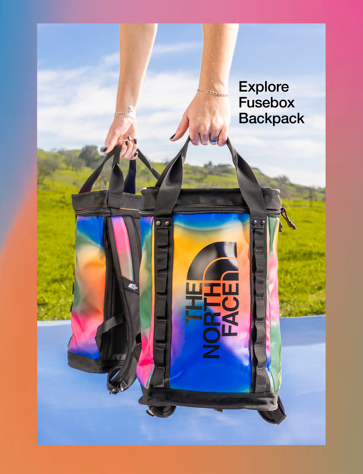 A person is holding a colorful backpack in their hand for a NorthFace photo shoot.