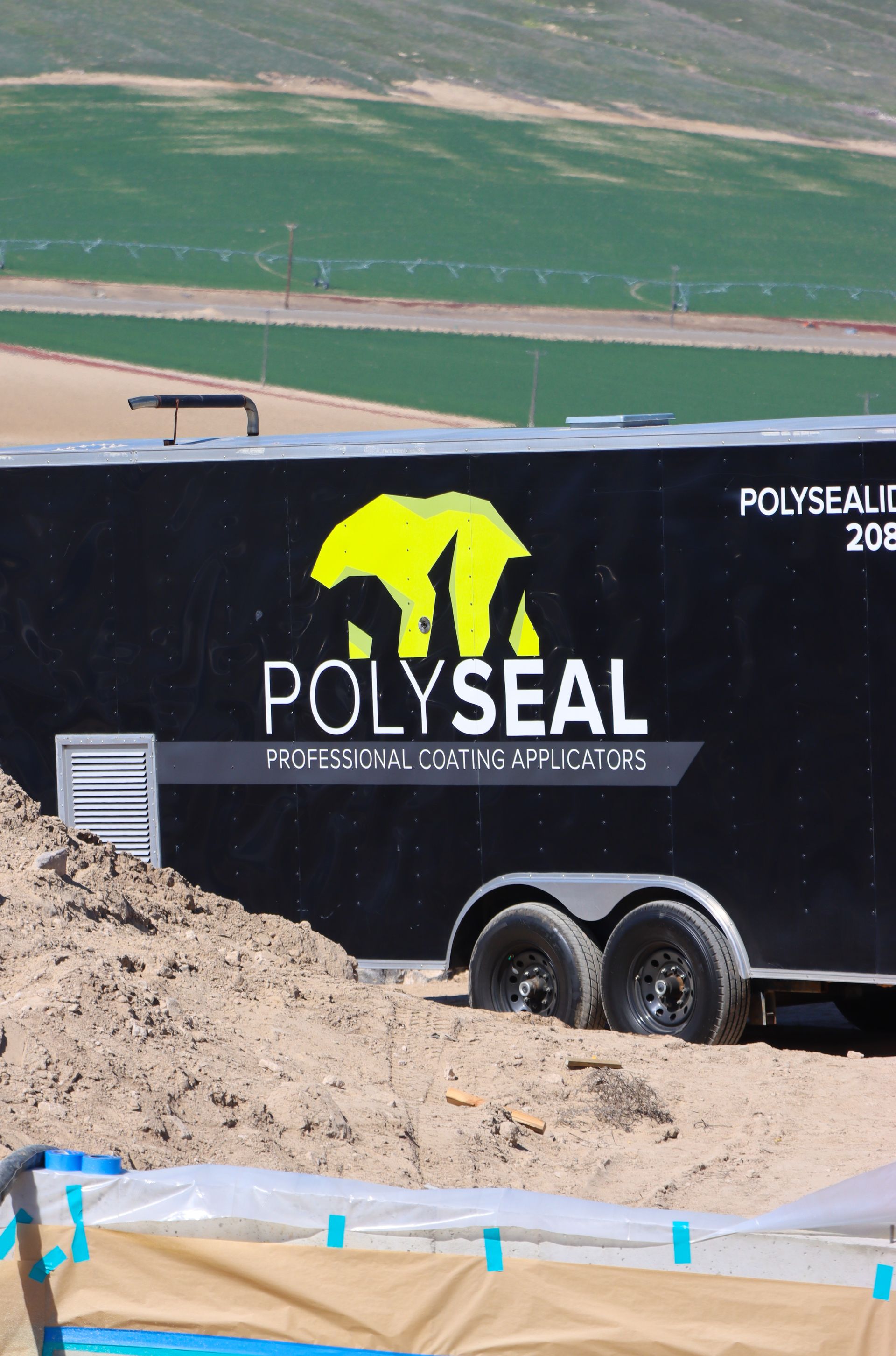 A black trailer with the word polyseal on it