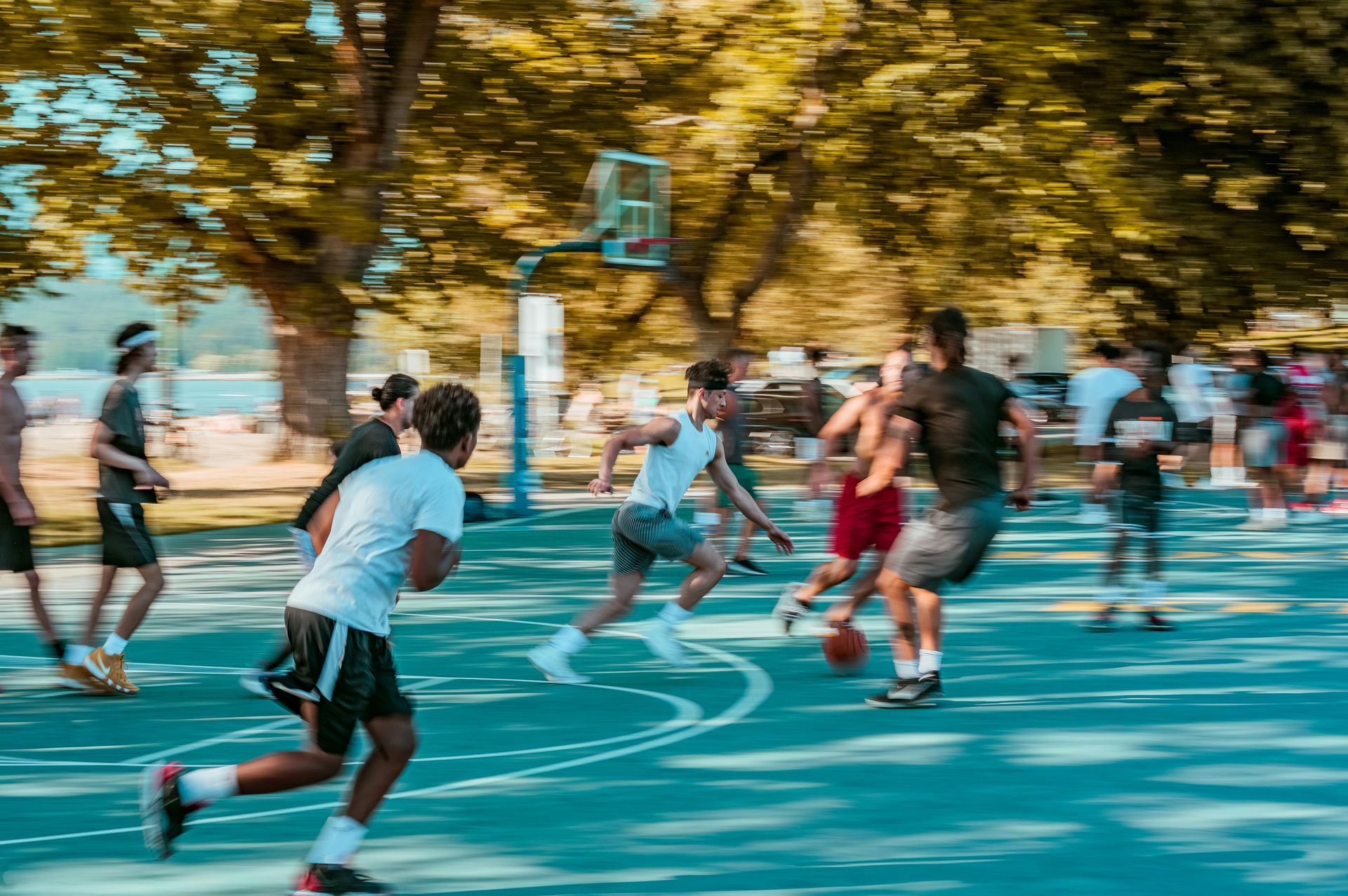 Youth basketball player training alone in gym focusing on skill development and improvement instead 