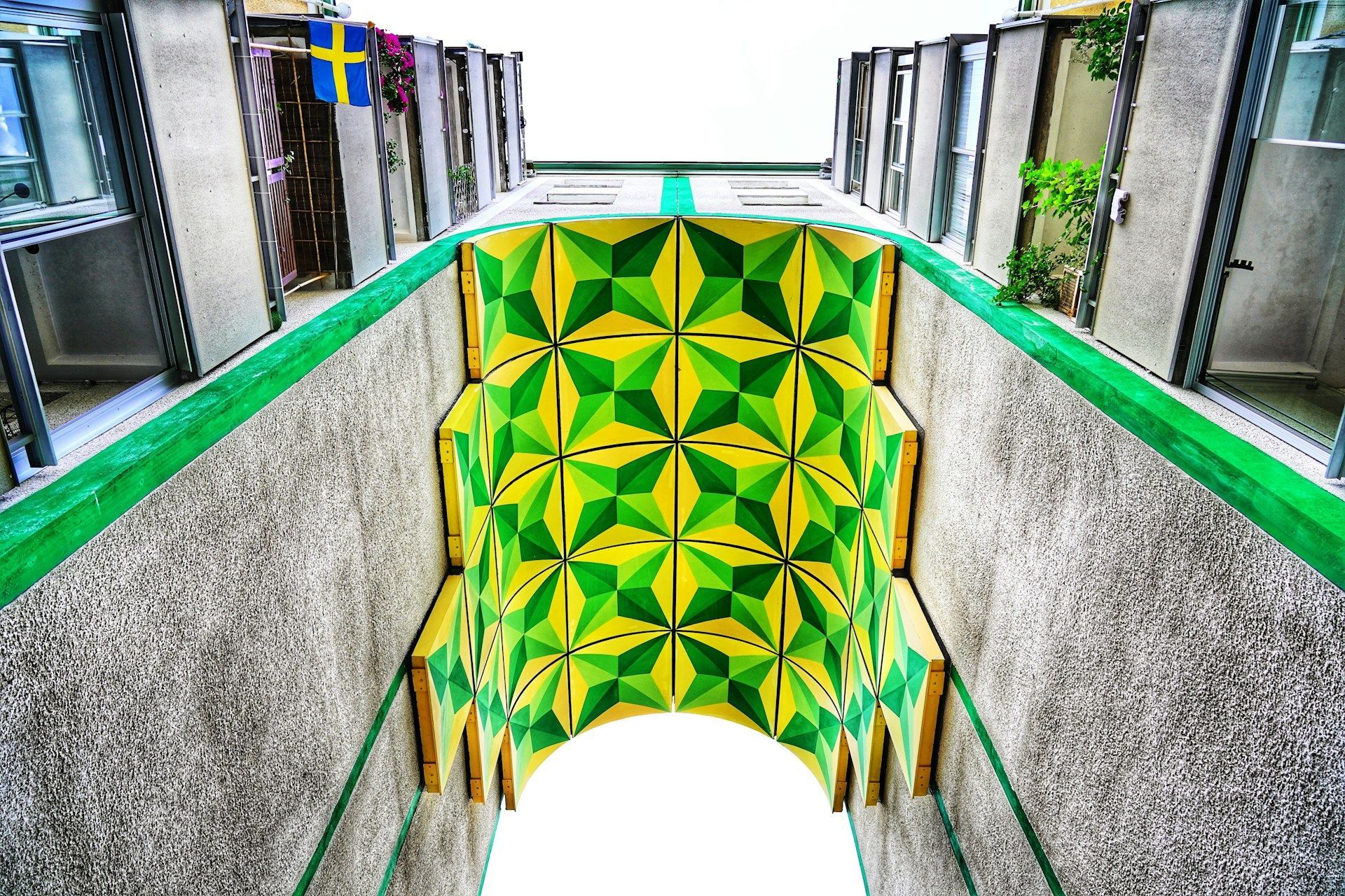 An arched ceiling decorated with a yellow and green geometric pattern at Södermalm, Stockholm.