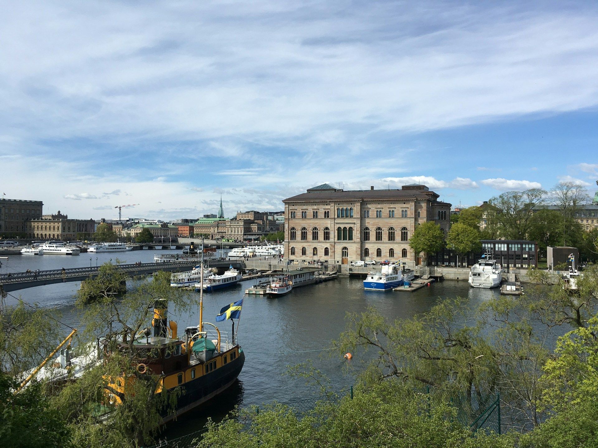 Boats moored at the Nationalmuseum on a sunny day in Stockholm, Sweden.