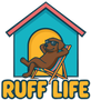 A brown dog relaxing in a beach chair in front of a blue doghouse; text "RUFF LIFE".