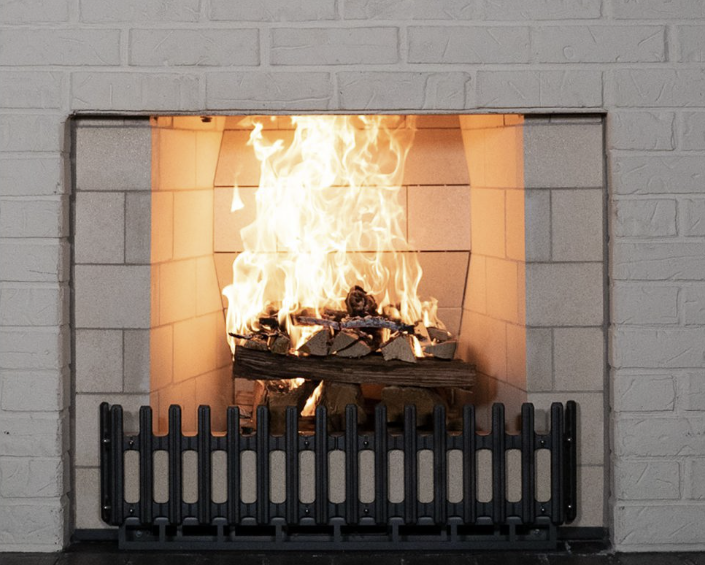 a brick fireplace with a white mantle in a living room .