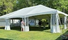A blue camping tent set up outdoors