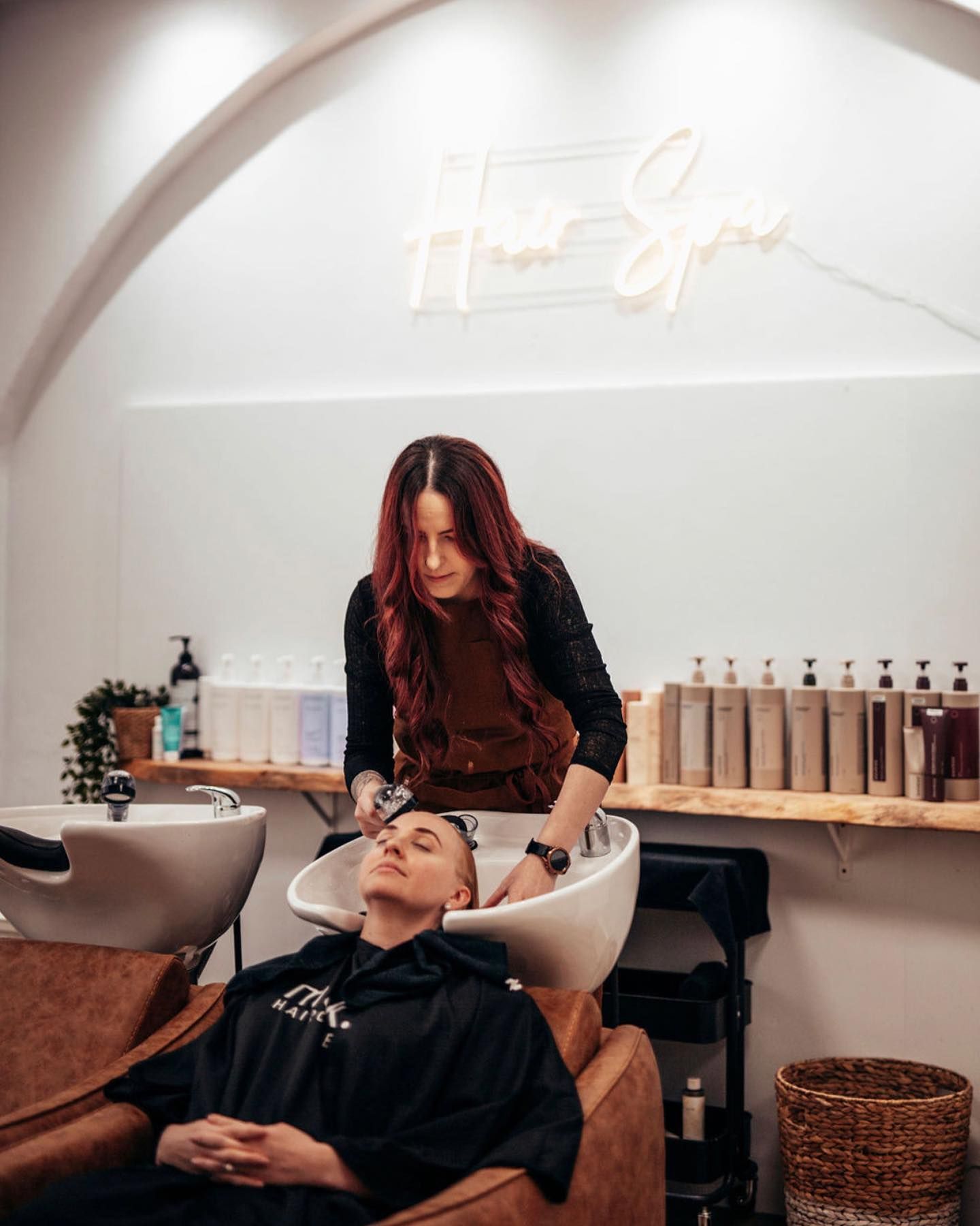 A Woman is Washing a Man 's Hair in a Salon — Tree House Salon In Nerang, QLD