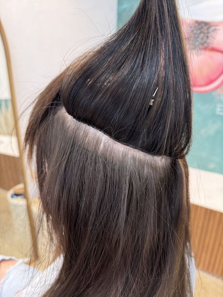 A Close Up of a Woman 's Hair With Extensions — Tree House Salon In Nerang, QLD