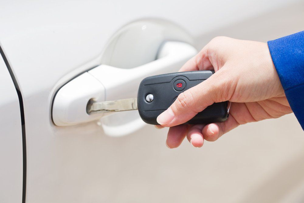 Opening The White Car On Key System Automatic — Locksmiths in Townsville, QLD