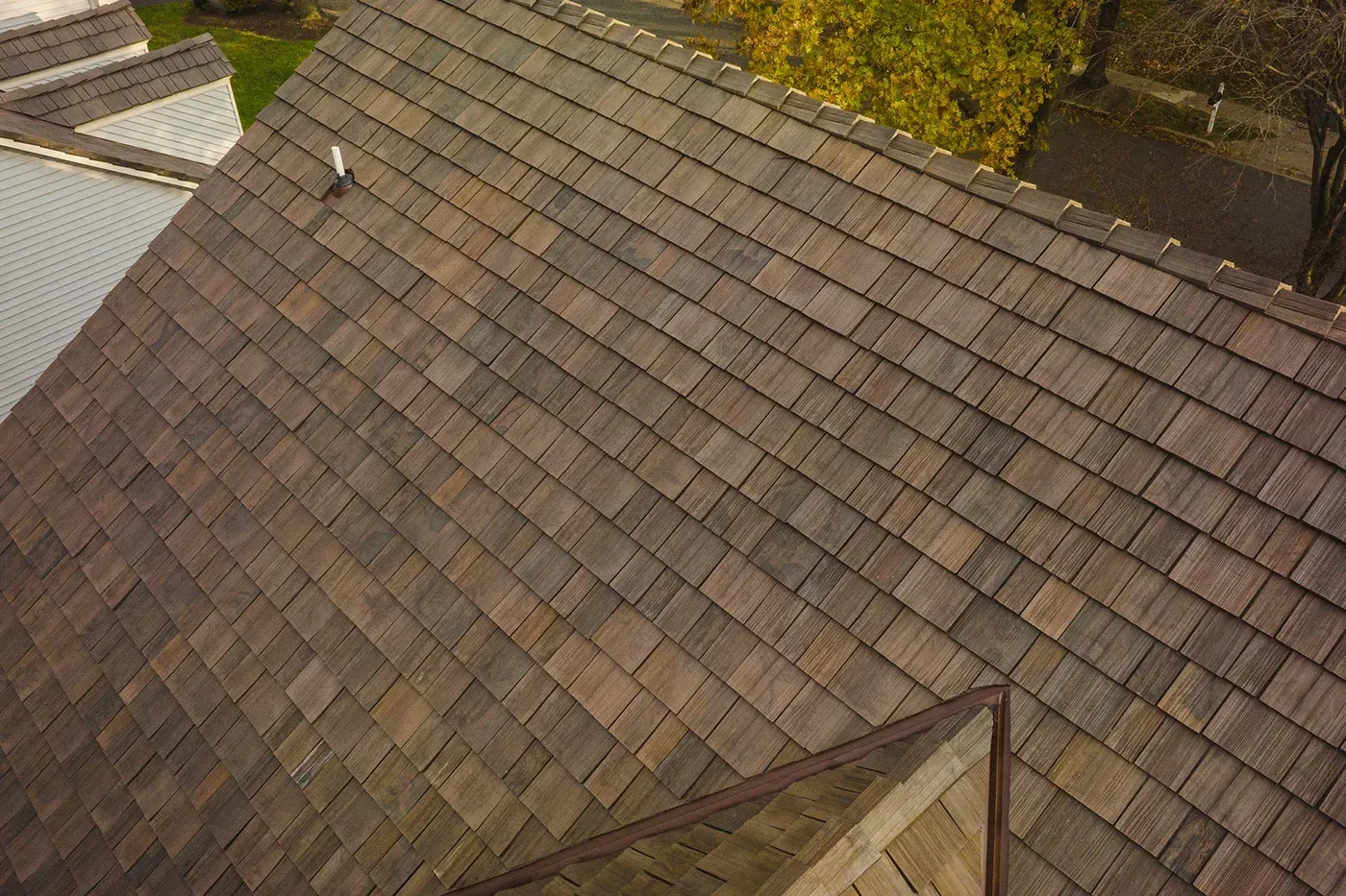 Composite cedar shake roof by Brava on a Georgia home for classic curb appeal and strength.