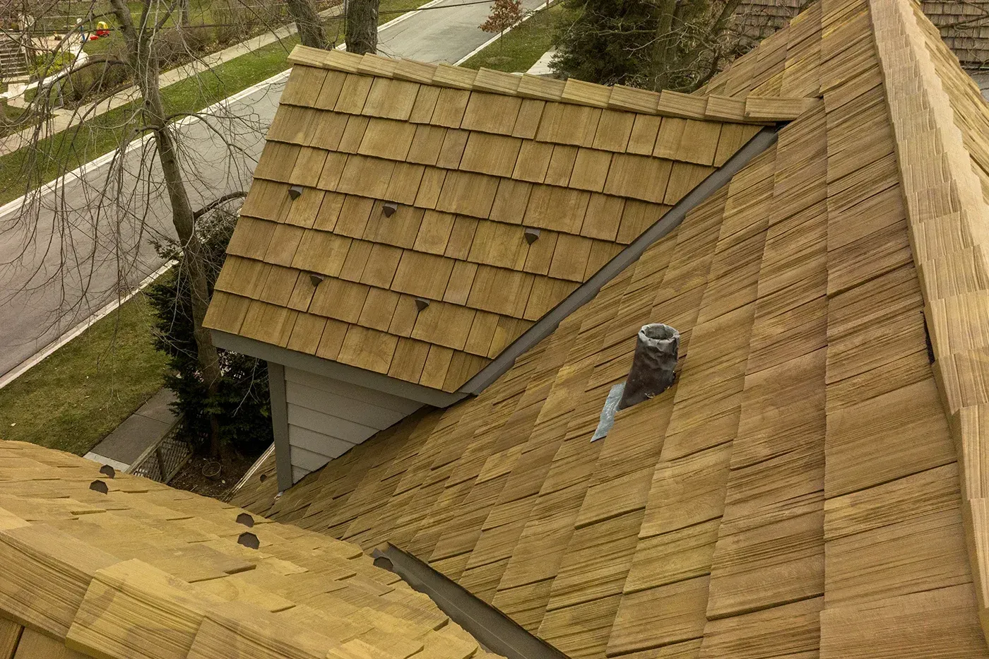 Cedar shake style Brava roof installed in Georgia, delivering rustic charm without the upkeep of real wood shingles.