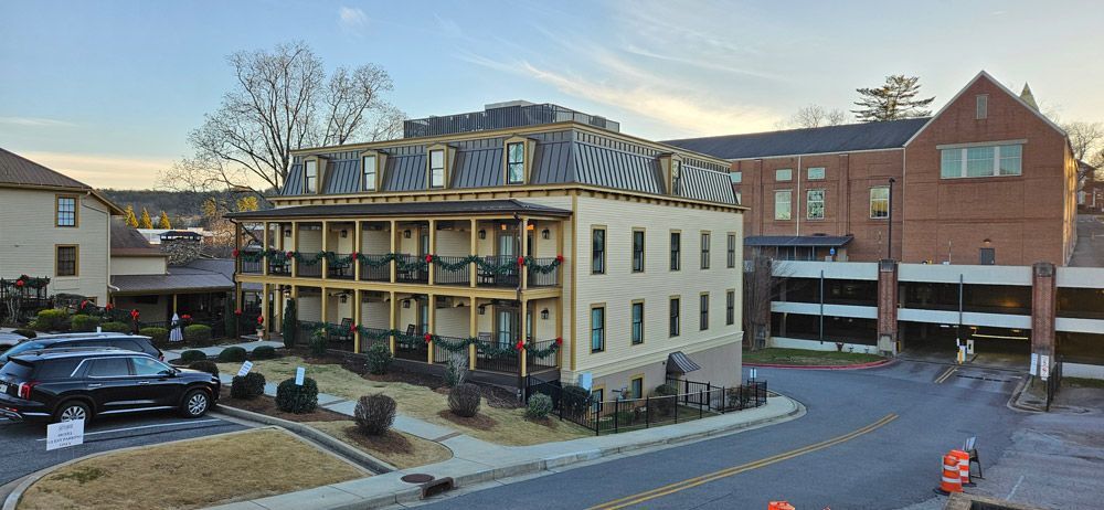 Smith House in Dahlonega Georgia, new siding installed by Edge. Buildings with parking garage.