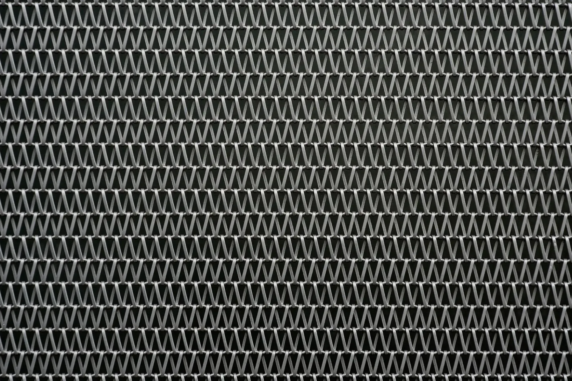 Close-up of micro-mesh gutter guard material used to filter small debris like pine needles, pollen, and roof grit